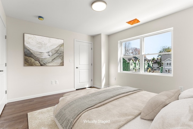 bedroom featuring dark wood-type flooring