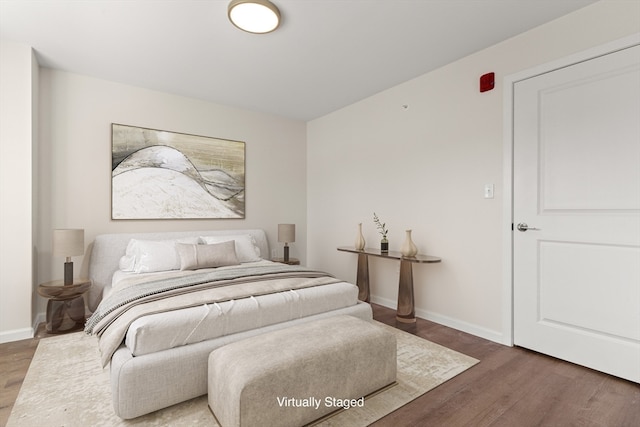 bedroom featuring dark wood-type flooring