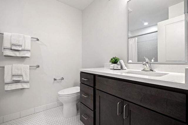 bathroom featuring tile patterned flooring, a shower with curtain, toilet, and vanity