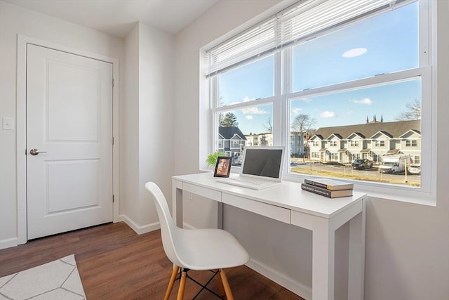 home office with dark wood-type flooring