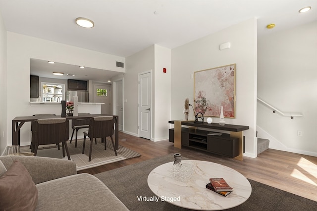 living room with dark hardwood / wood-style floors