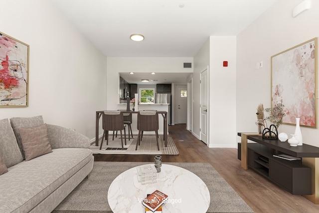 living room with dark wood-type flooring