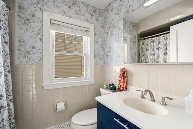 bathroom featuring vanity, tile walls, toilet, and a shower with shower curtain