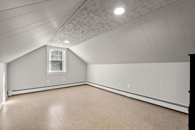 bonus room featuring baseboard heating and lofted ceiling