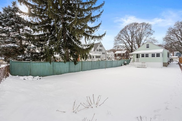 view of yard layered in snow