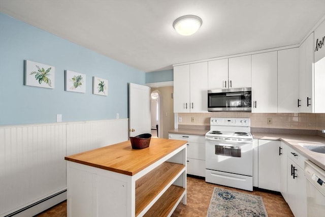 kitchen with a baseboard heating unit, white cabinets, and white appliances