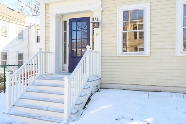 view of snow covered property entrance