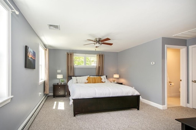 bedroom featuring baseboards, baseboard heating, light colored carpet, and visible vents