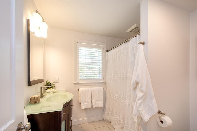 full bath with tile patterned flooring, baseboards, a shower with shower curtain, and vanity