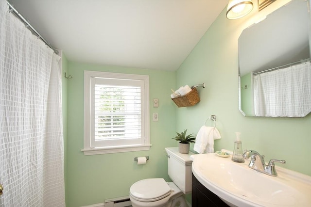 full bathroom featuring vanity, baseboard heating, and toilet
