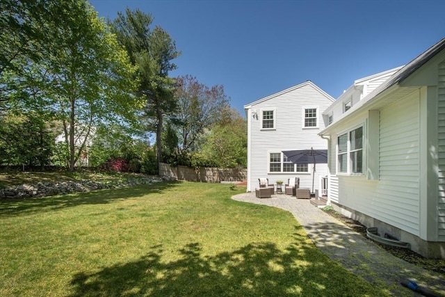 view of yard featuring central air condition unit, fence, outdoor lounge area, and a patio