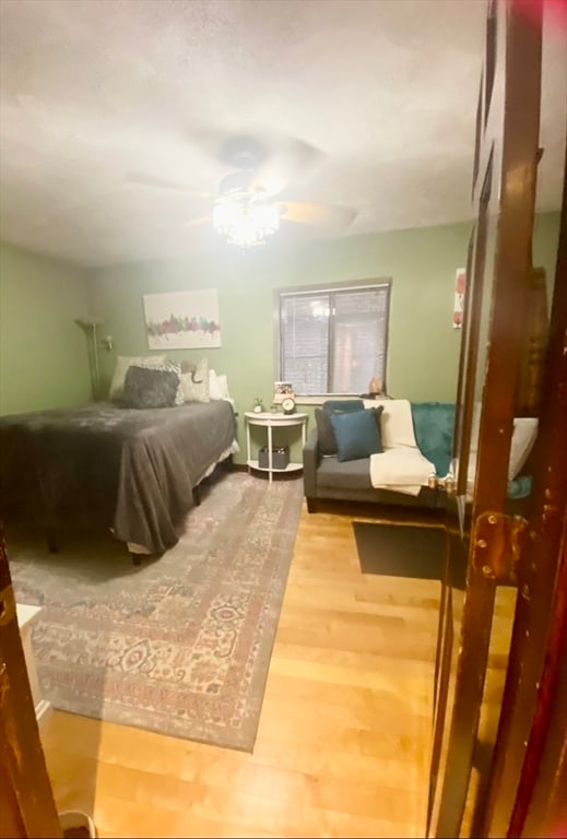 bedroom featuring ceiling fan and hardwood / wood-style floors