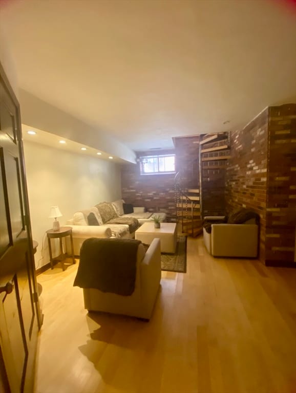 unfurnished living room with light wood-type flooring