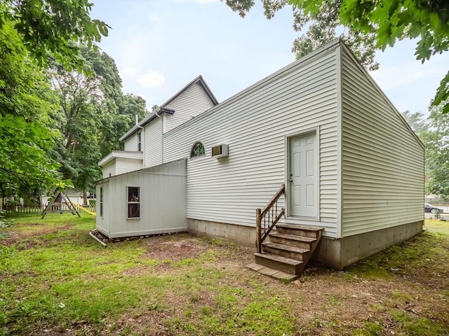 rear view of house with a lawn