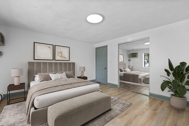 84 Grant St Unit 7, Somerville, MA 02145 - bedroom with light wood-type flooring and baseboards
