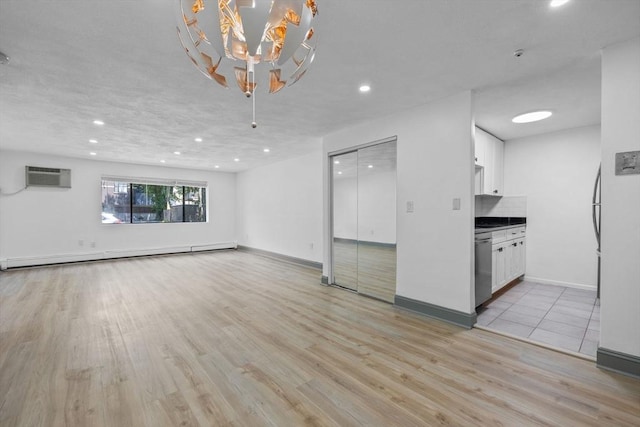 84 Grant St Unit 7, Somerville, MA 02145 - unfurnished living room featuring baseboard heating, light wood-type flooring, recessed lighting, a wall mounted AC, and a chandelier