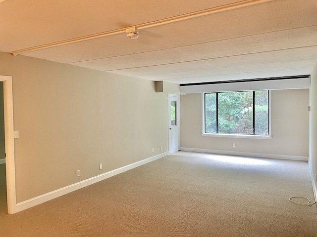 1500 Worcester Rd Unit 631, Framingham, MA 01702 - empty room featuring carpet flooring, a smoke detector, and beam ceiling