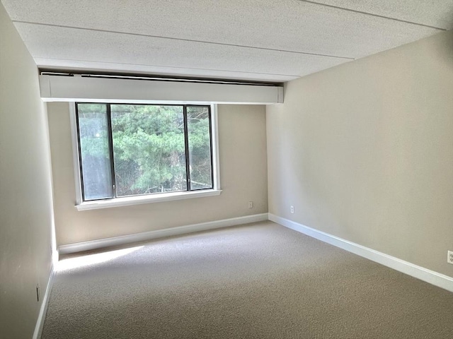 1500 Worcester Rd Unit 631, Framingham, MA 01702 - carpeted spare room featuring baseboards and a textured ceiling