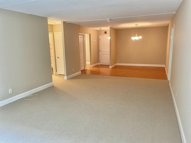 1500 Worcester Rd Unit 631, Framingham, MA 01702 - empty room featuring carpet and a chandelier