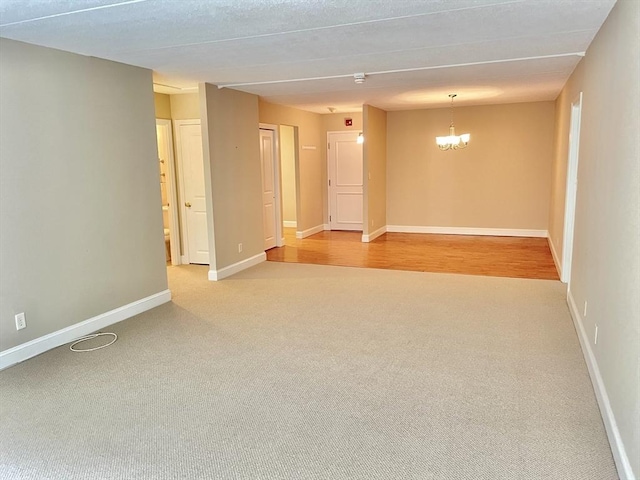1500 Worcester Rd Unit 631, Framingham, MA 01702 - spare room with light carpet and a chandelier