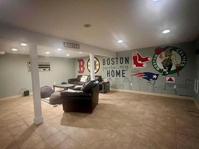 living area featuring recessed lighting and baseboards