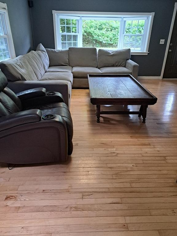 31-33 Mathews Dr, Wayland, MA 01778 - living room featuring light wood-style floors and healthy amount of natural light