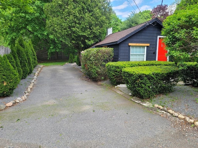 31-33 Mathews Dr, Wayland, MA 01778 - view of home's exterior with a chimney