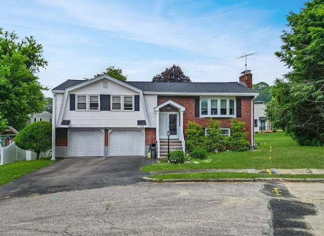 23 Harvard Cir, Needham, MA 02494 - raised ranch with brick siding, driveway, an attached garage, a chimney, and a front lawn