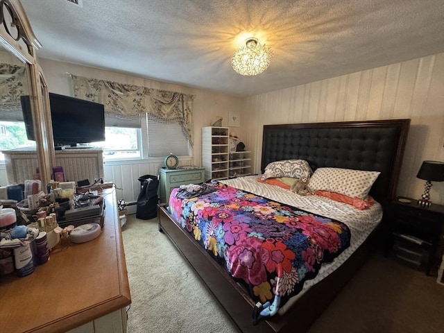 23 Harvard Cir, Needham, MA 02494 - bedroom with light carpet, a chandelier, and a textured ceiling