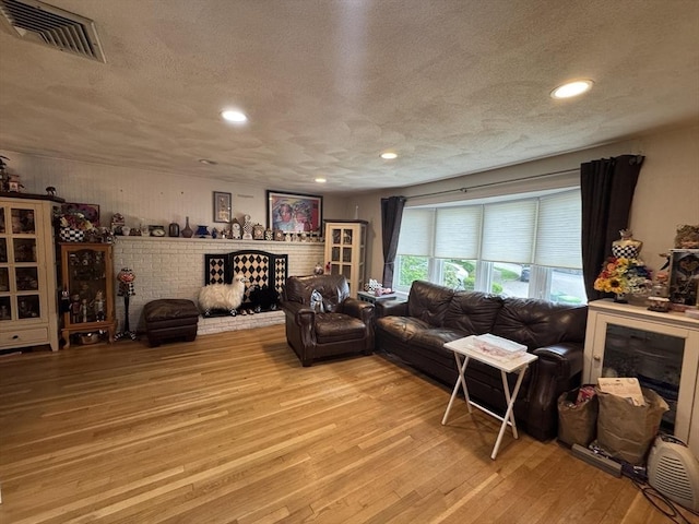 23 Harvard Cir, Needham, MA 02494 - living room featuring light wood-style floors, recessed lighting, and a textured ceiling