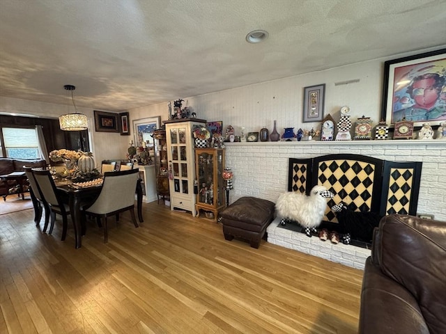 23 Harvard Cir, Needham, MA 02494 - dining area featuring hardwood / wood-style flooring and a textured ceiling