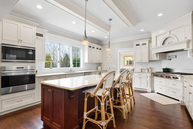 kitchen with dark wood finished floors, an island with sink, glass insert cabinets, and built in microwave