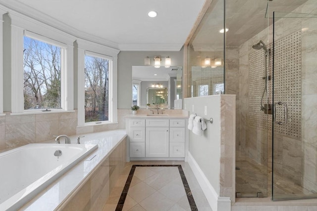 bathroom featuring a garden tub, a stall shower, ornamental molding, recessed lighting, and vanity