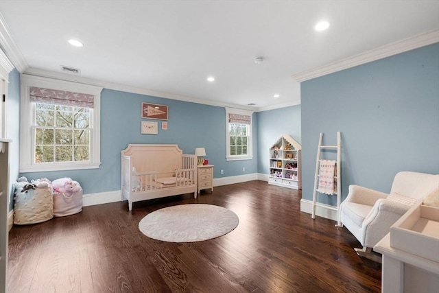 bedroom with recessed lighting, ornamental molding, baseboards, and wood finished floors