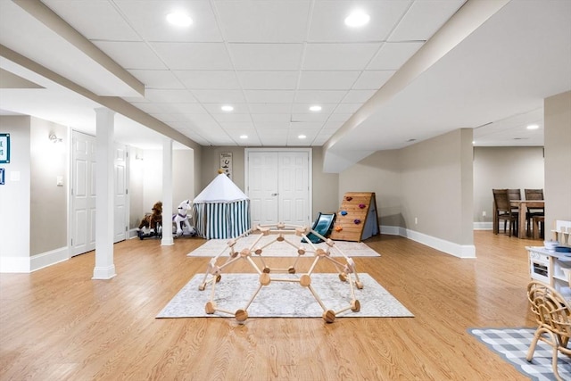 rec room featuring recessed lighting, wood finished floors, and baseboards