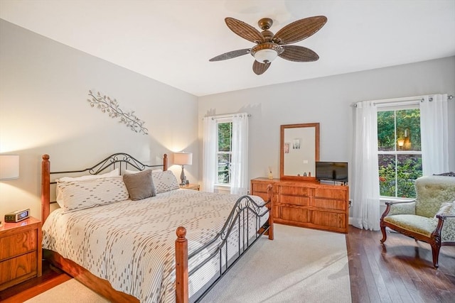 bedroom with a ceiling fan and hardwood / wood-style floors