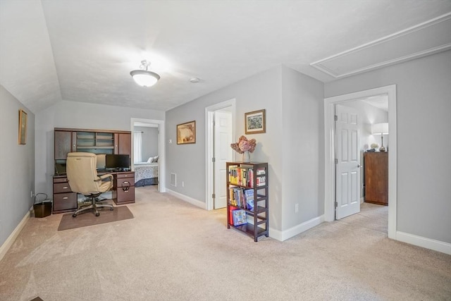 office space with baseboards, carpet flooring, and attic access