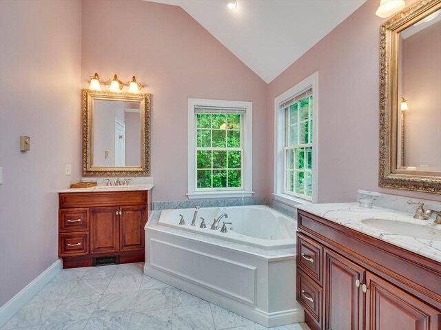 14 Nassau Dr, Winchester, MA 01890 - bathroom featuring two vanities, a sink, vaulted ceiling, marble finish floor, and a garden tub