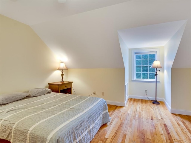 14 Nassau Dr, Winchester, MA 01890 - bedroom featuring light wood-style flooring, vaulted ceiling, and baseboards