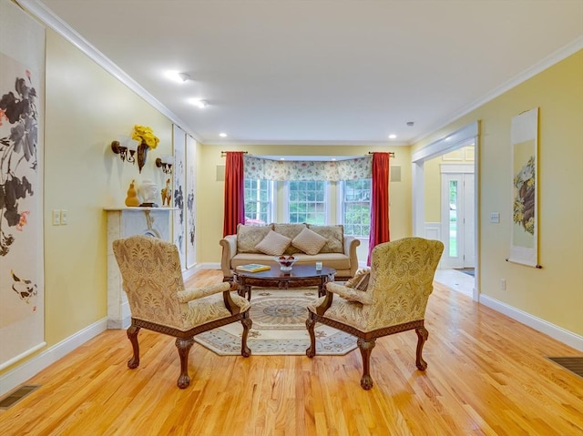 14 Nassau Dr, Winchester, MA 01890 - living room with ornamental molding, visible vents, and wood finished floors