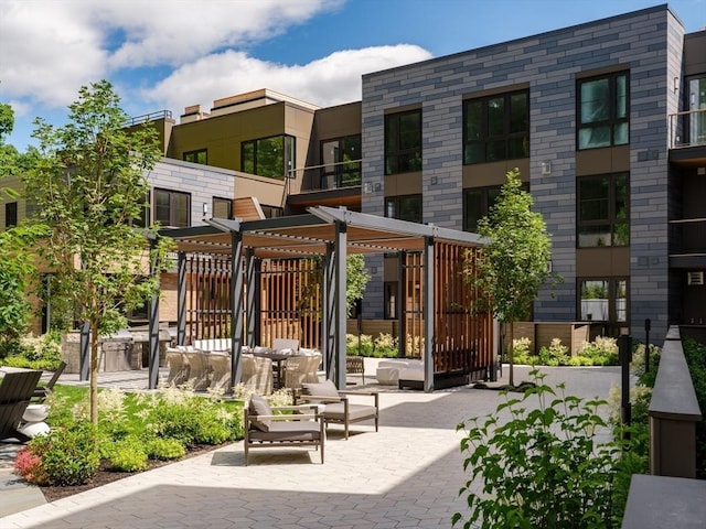 surrounding community featuring a pergola and a patio