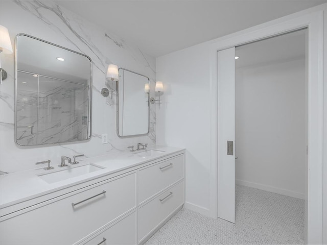 bathroom with tile patterned floors, vanity, and walk in shower