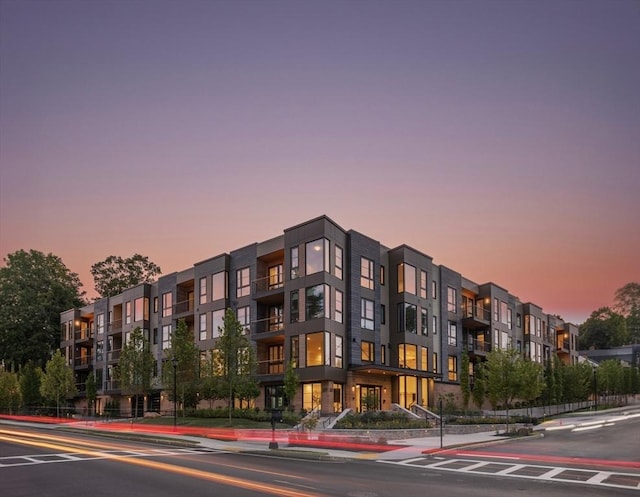 view of outdoor building at dusk