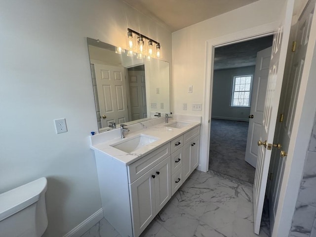 bathroom with vanity and toilet