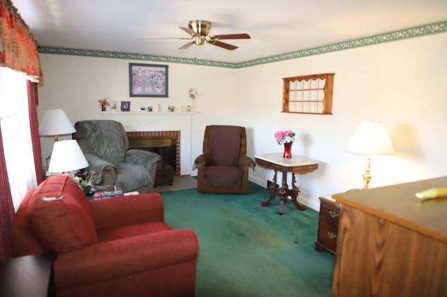 carpeted living room featuring a brick fireplace and a ceiling fan