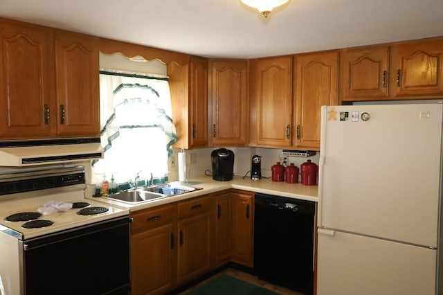 kitchen with ventilation hood, light countertops, black dishwasher, freestanding refrigerator, and electric range