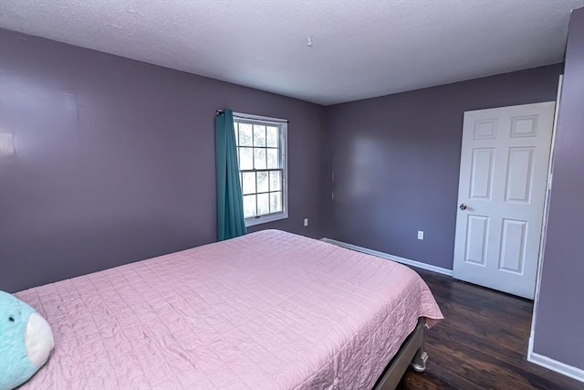 bedroom featuring dark wood-type flooring