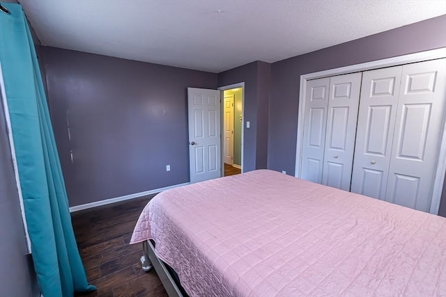 bedroom featuring a closet and dark hardwood / wood-style floors