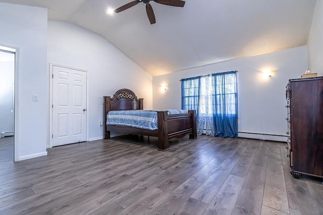 bedroom featuring baseboard heating, hardwood / wood-style flooring, vaulted ceiling, and ceiling fan