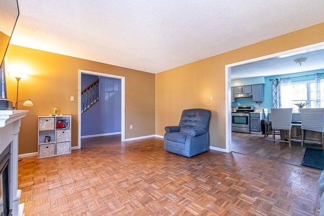 sitting room with dark parquet floors